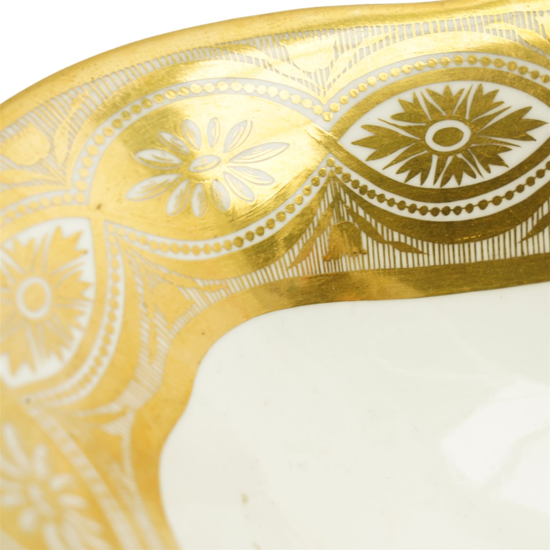 Early 19th century Derby comport of shaped oval design, the interior painted with a large spray of Spring flowers, the gilt border with a continuous band of flower heads repeated on the oval foot, red painted mark, pattern 42 L34cm