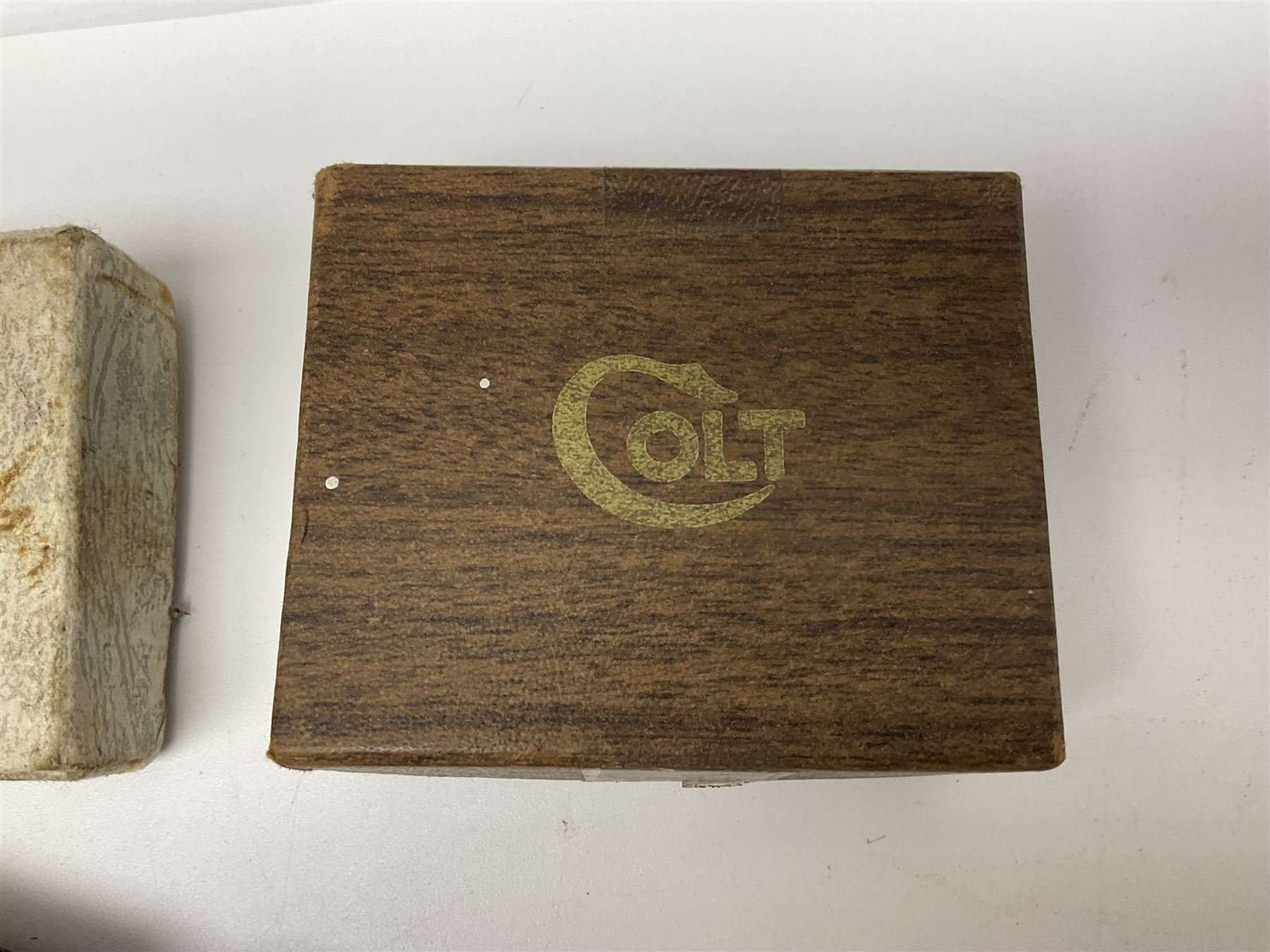 Six pairs of revolver grips;  pair of Lightwood & Son Ltd powder/shot measures in original box; and boxed Colt hammer shroud 