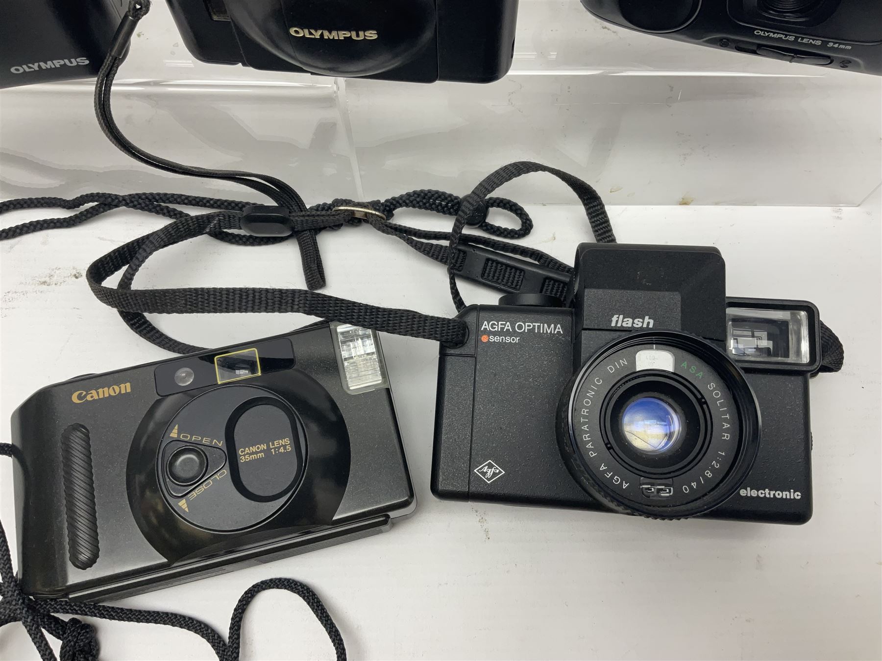 Four Olympus cameras, to include AF10 Super, XA2, Shoot & Go and Supertrip examples, together with Miranda ME-Z and Miranda ME-X DX cameras, an Agfa Optima camera with Agfa Paratonic DIN ASA Solitar 1:2.8/40 lens, Canon Snappy S camera and a Fujifilm Fine Pix S5700 camera, serial no 7WE12368 (8)