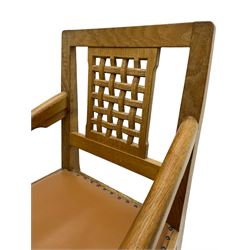 Rabbitman - set of six (4+2) oak dining chairs, carved and pierced lattice back, tan leather upholstered seat with stud band, on octagonal supports united by H-stretchers, carved with rabbit signature, by Peter Heap, Wetwang 