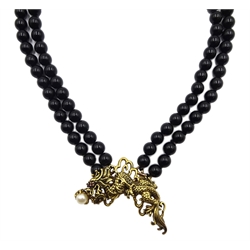 Franklin Mint 'Year of the Dragon' two strand black onyx necklace with detachable silver-gilt brooch set with a pearl and ruby eyes, stamped 925, designed by Kai-Yin Lo ,with certificate