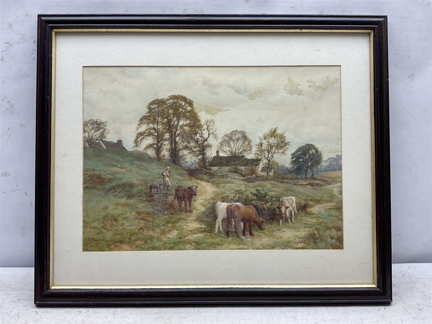 Frederick James Knowles (British 1874-1931): Calves by a Farmstead, watercolour signed 29cm x 40cm