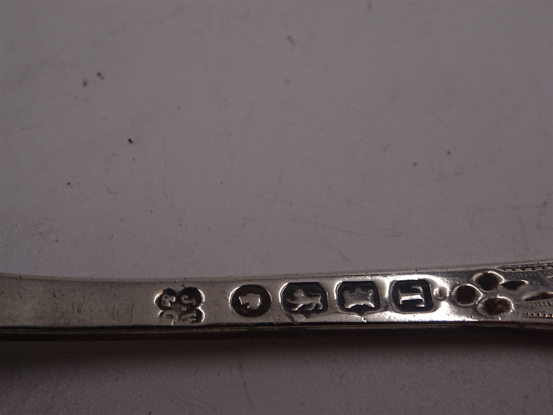 George III Exeter silver Old English pattern table spoon, engraved with foliate decoration, initials and dated 1784 to terminal, hallmarked Exeter 1783, maker's mark indistinct, together with Newcastle silver Fiddle pattern butter knife, hallmarked John Walton, Newcastle 1823, Victorian Exeter silver spoon, engraved with floral design to underside of bowl, hallmarked Josiah Williams & Co, Exeter 1875