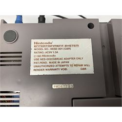 Nintendo Entertainment System (1985) console with two controllers, accessories and instruction booklet. NES Games ‘Duck Hunt’ with Nintendo Zapper gun, ‘Pinball’ and ‘Super Mario Bros.’, all with original sleeves and instruction booklets. NES game ‘Super Mario Bros. 2’ cartridge only