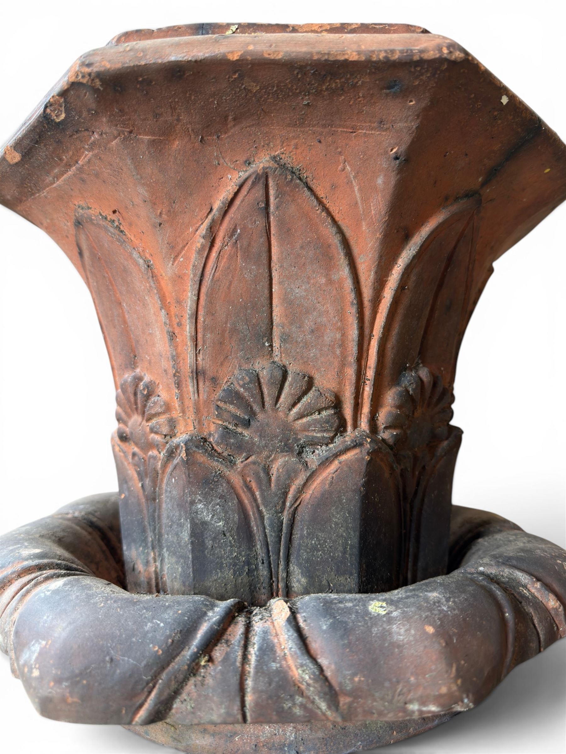 Small 19th century terracotta octagonal planter with stand, flower and leaf design