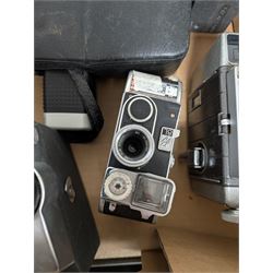 Collection of vintage cine cameras, including Bolex Paillard B8L, Mansfield Holiday Meter Matic, Quarz, Bell & Howell Autoset, Sankyo Super Micro, Canon Demi C, Agfa Movexoom, etc