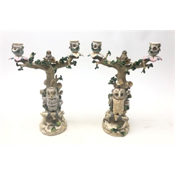  Pair of 19th century Ernst Bohne Söhne porcelain candelabra modelled as Owls perched on a tree, H29cm (a/f)  