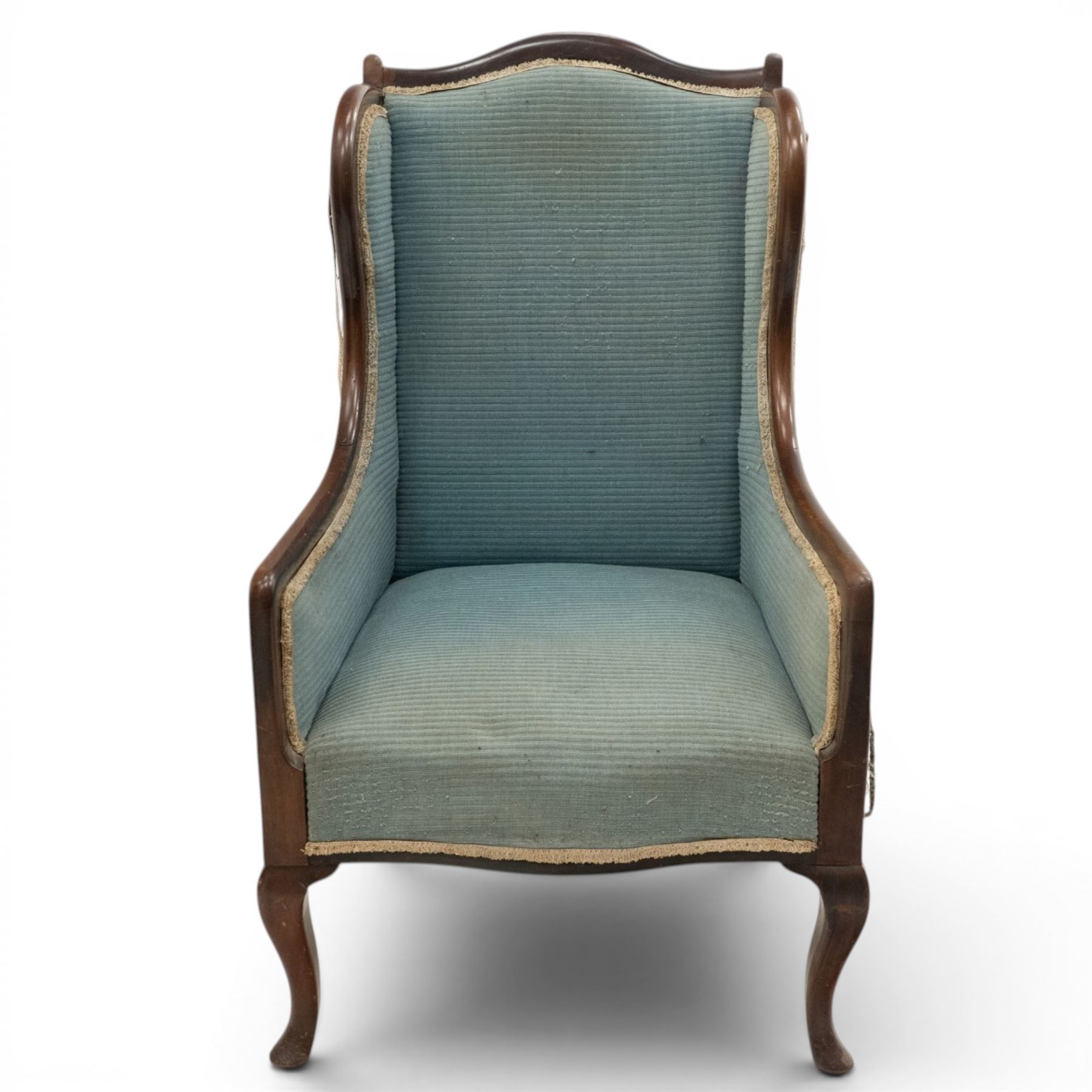 Edwardian armchair of squared form upholstered in blue fabric, serpentine seat front, shaped frame raised on cabriole supports