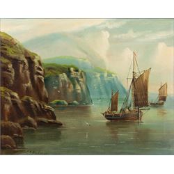 Edward King Redmore (British 1860-1941): Boats Sailing off a Rocky Coast, oil on canvas si...