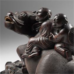Early 20th century Chinese carved hardwood figural group of two boys on the back of a water buffalo on wooden stand W37cm