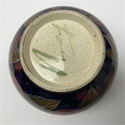 Early/mid 20th century William Moorcroft bowl, of squat bulbous form, decorated in the pomegranate pattern upon a dark blue ground, with painted signature and impressed mark beneath, H10.5cm D11cm