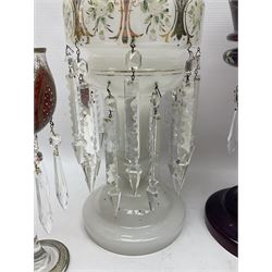 Bohemian red glass lustre, painted with stylised floral and foliate decoration, together with a milk glass example and two bohemian goblets converted to lustres 