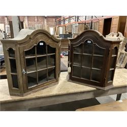 Dutch design oak wall hanging apothecary cabinet, of arched form with single astragal style glazed door enclosing single shelf (W69cm D18cm H69cm); together with another similar of corner form (W75cm D48cm H69cm) - THIS LOT IS TO BE COLLECTED BY APPOINTMENT FROM THE OLD BUFFER DEPOT, MELBOURNE PLACE, SOWERBY, THIRSK, YO7 1QY