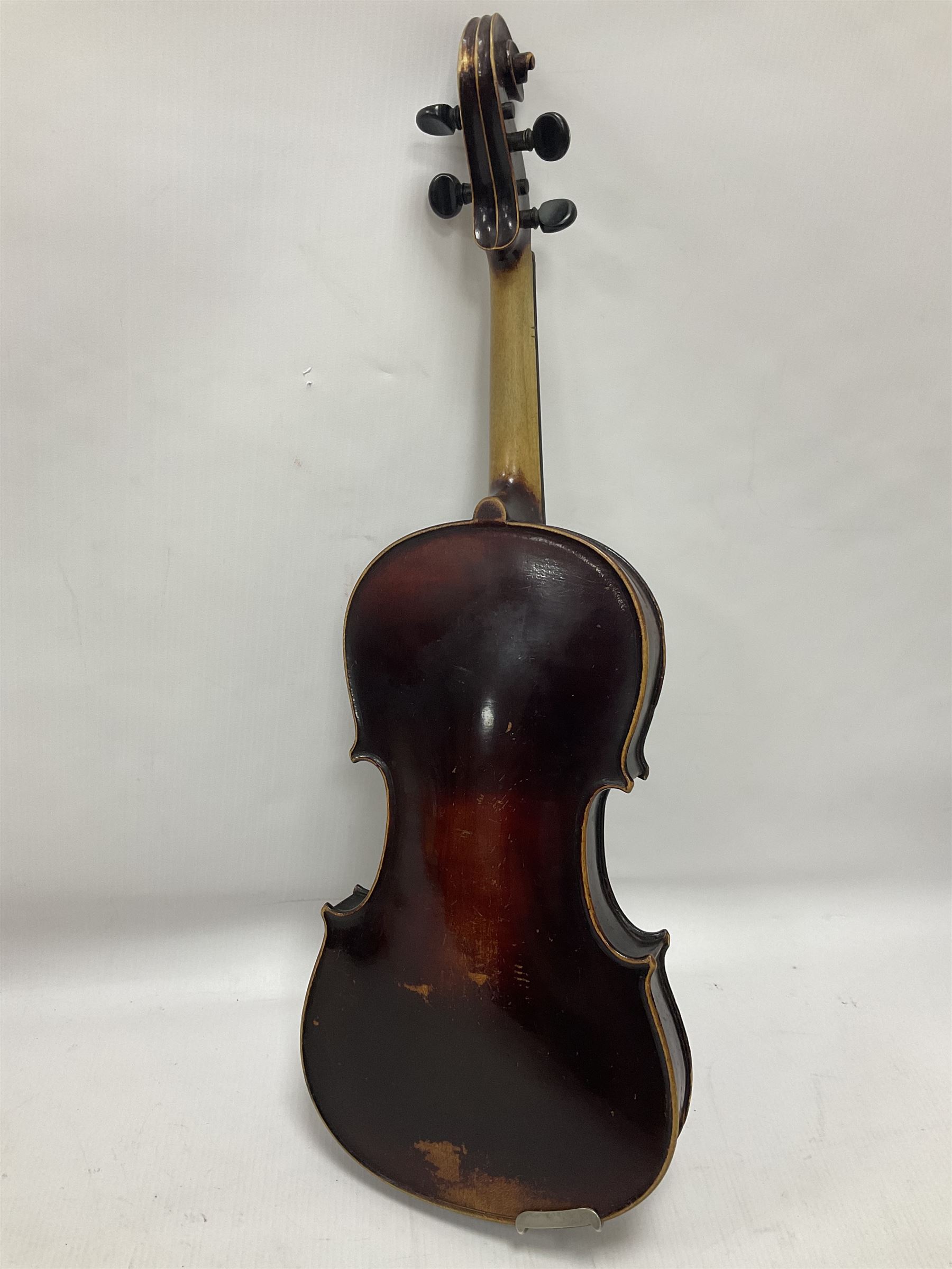 Neuner & Hornstiner early 20th century half size violin c1900, two piece maple back and ribs with a spruce top in a later ridged carrying case, no bow Length 57cm