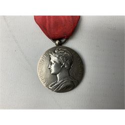 Five continental medals - WW1 Belgian Cross of Fire; WW1 French Croix De Guerre; French Croix De Combattant; French Republic Workers silver merit awarded to L. Mounet 1950; and boxed French Palmes Universitaires Officier d'Academie silver and enamel wreath (5)