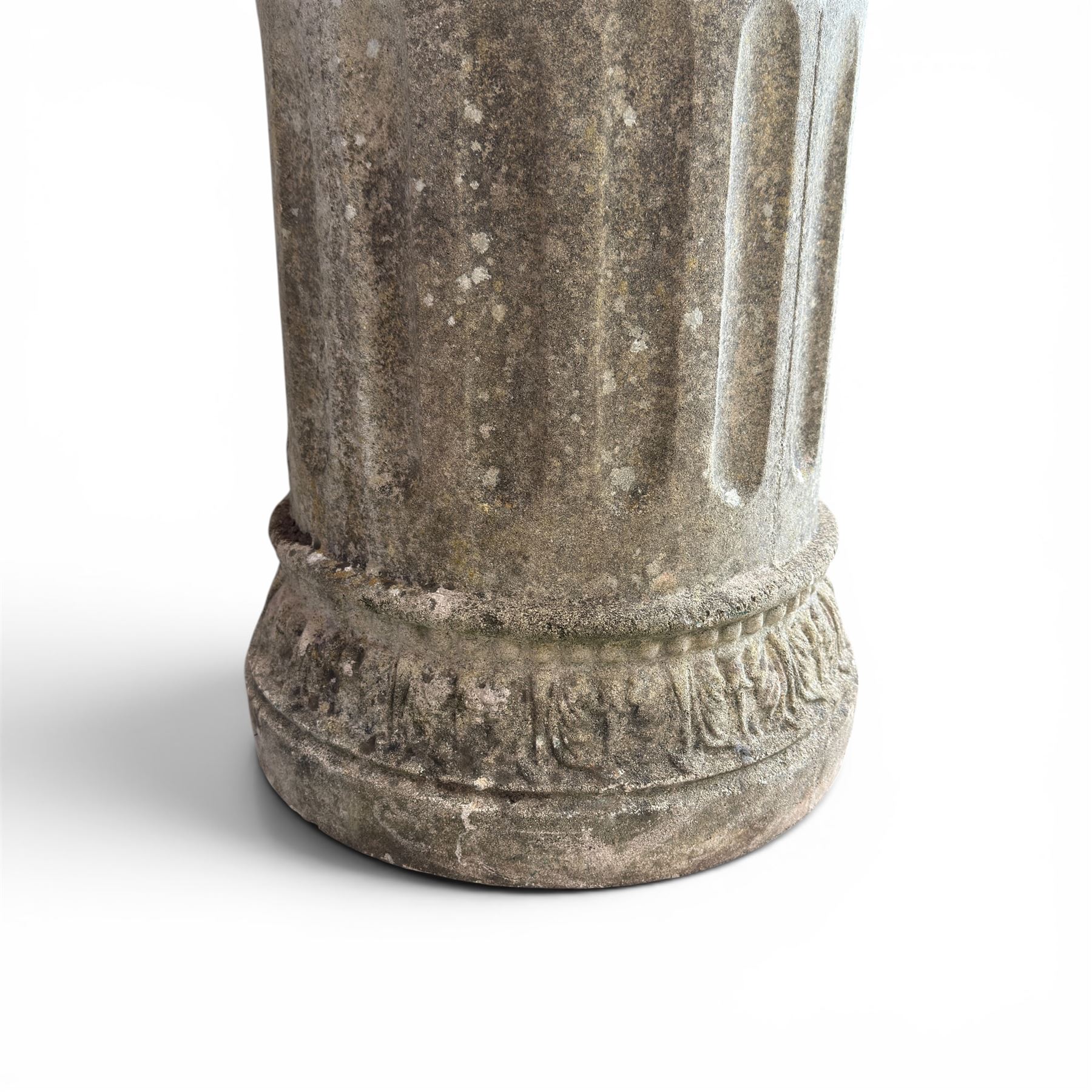 20th century good quality weathered cast stone pedestal urn of ecclesiastical design, circular lobed bowl with rope twist and lattice border, raised on squat base with fluted column  and acanthus decorated base