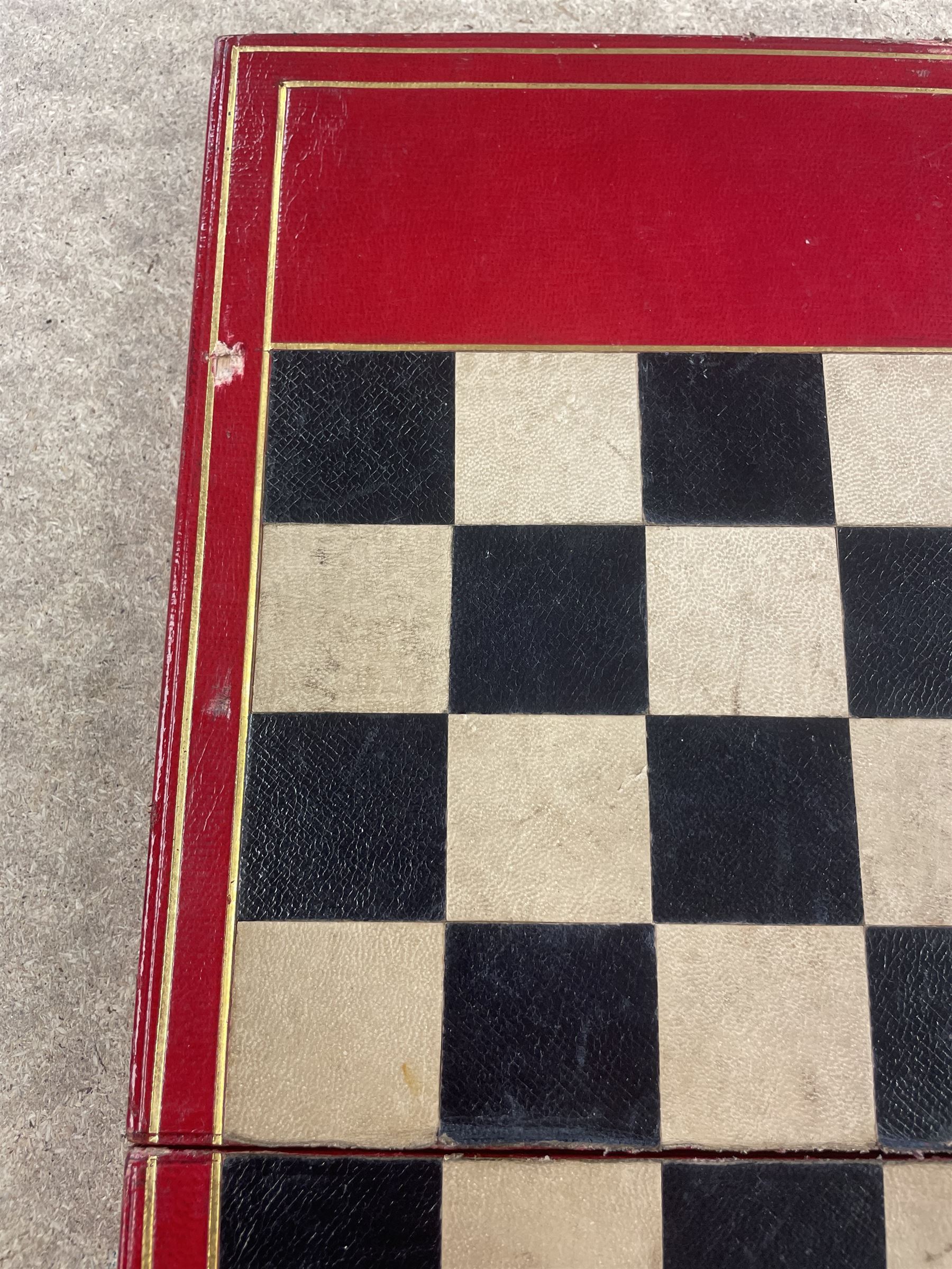 19th century walnut and brass bound games compendium box, painted to enhance the grain, of rectangular form, the hinged opening cover with rounded sides, central brass cartouche with engraved lion crest, and brass riveted straps, opening to reveal a red leather and blue silk lined compartmented interior, with fold-down games board, and lift-out tray containing playing cards, ebony turned dice towers, white and red stained bone draughts, and chess pieces, ivory dice, and ivory and ebony whist markers, and brass bezique board, cribbage board and markers, H15cm W32cm D24cm
This lot has been registered for sale under Section 10 of the APHA Ivory Act