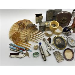A group of assorted collectables, to include small oval purple guilloche enamel frame, WWII matchbox holder depicting Winston Churchill, Halcyon Days enamel box, Ronson table lighter, ebonised glove stretchers, ivory napkin ring, mother of pearl handled button hook, engine turned cigarette case, etc. 