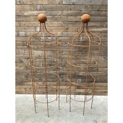Pair of Country House wrought iron garden obelisks with ball finial, raise in four tiers