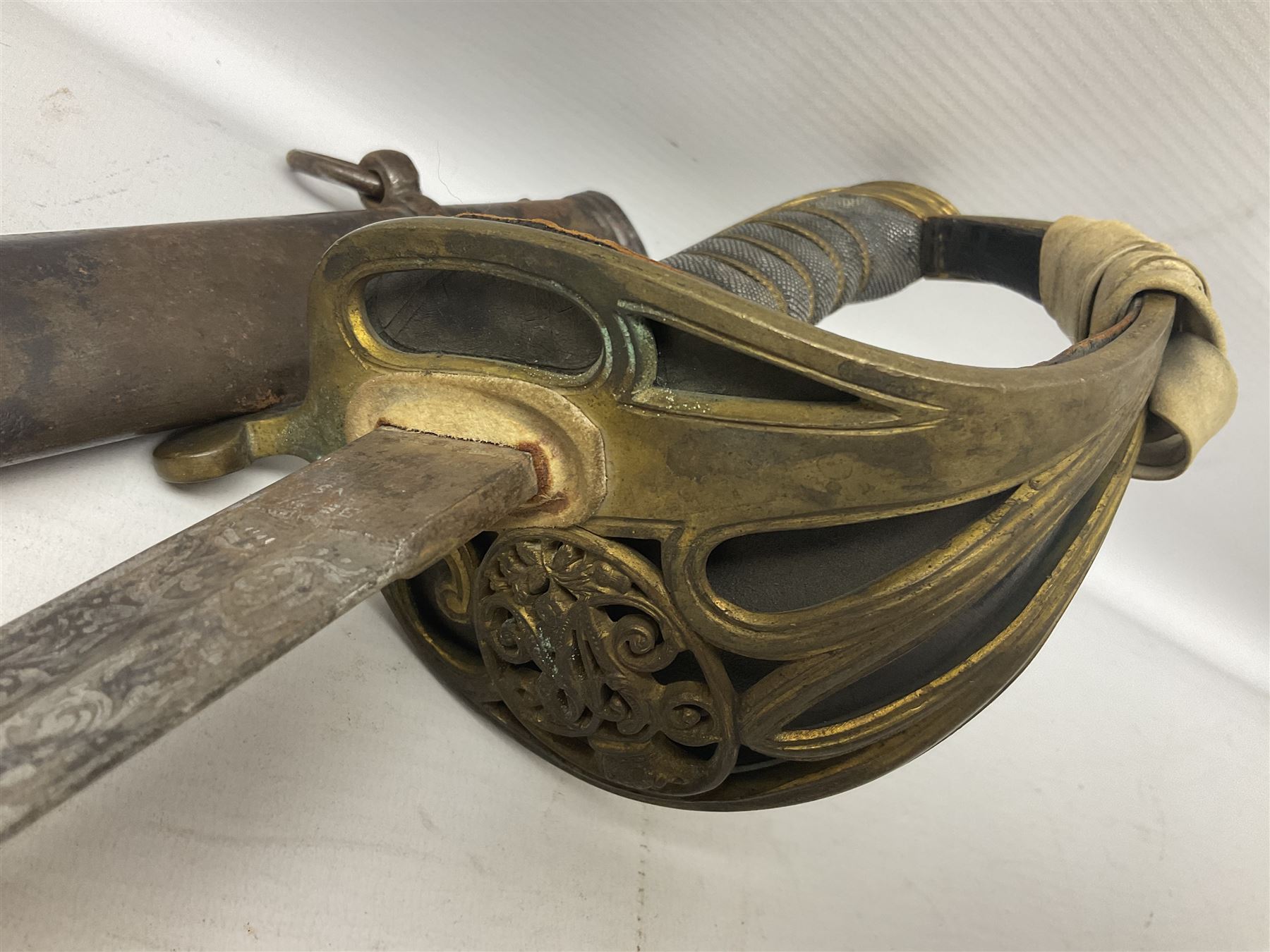 Victorian British Army officer's sword by Hobson & Sons Little Windmill Street London, the 82cm fullered steel blade etched with crowned Victoria cypher and 'HM 1st West York R.V.', lined gilded brass three-bar hilt incorporating Victoria cypher and wire-bound fish skin grip with plaited knot; in steel scabbard with two hanging rings L99cm overall