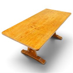 Acornman - adzed oak refectory dining table, rectangular adzed top with rounded corners raised on twin shaped end supports terminating to sledge feet united by pegged stretcher, carved with acorn signature