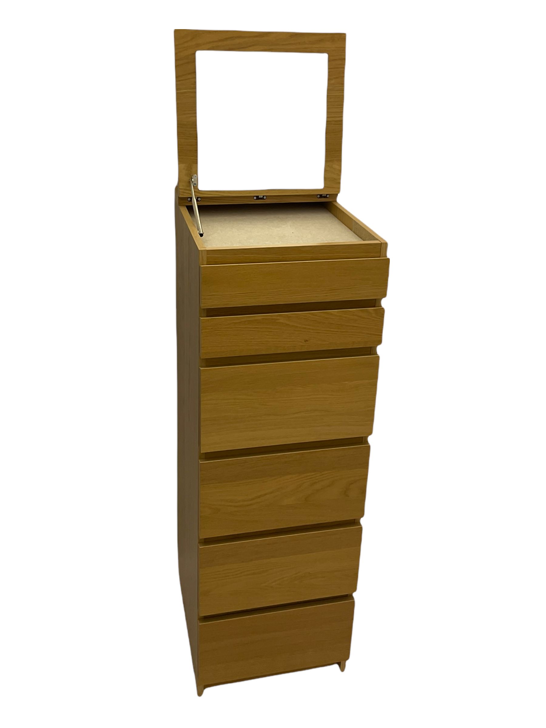 IKEA light oak finish chest, fitted with hinged vanity top, above six graduating drawers 