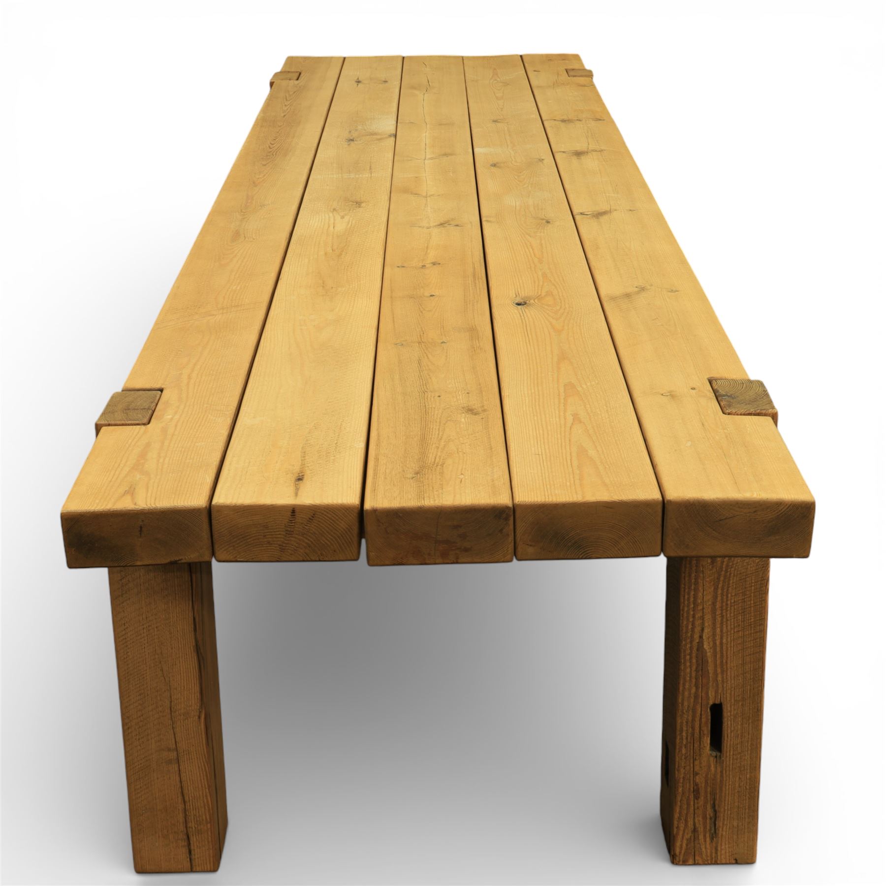 Modern large oak plank top dining table and twelve brown leather high back chairs, table of rustic construction five solid planks with exposed supports, the chairs in brown leather hide with ten standard height and a pair of taller chairs for the foot and head of the table