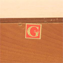 G-Plan - teak corner media unit, shaped top above a sliding central shelf above an open recess, flanked by further shelves, raised on a plinth base with a rear aperture for wires