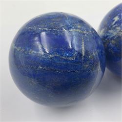 Pair of Lapis lazuli spheres, upon a carved stone stands, D8cm