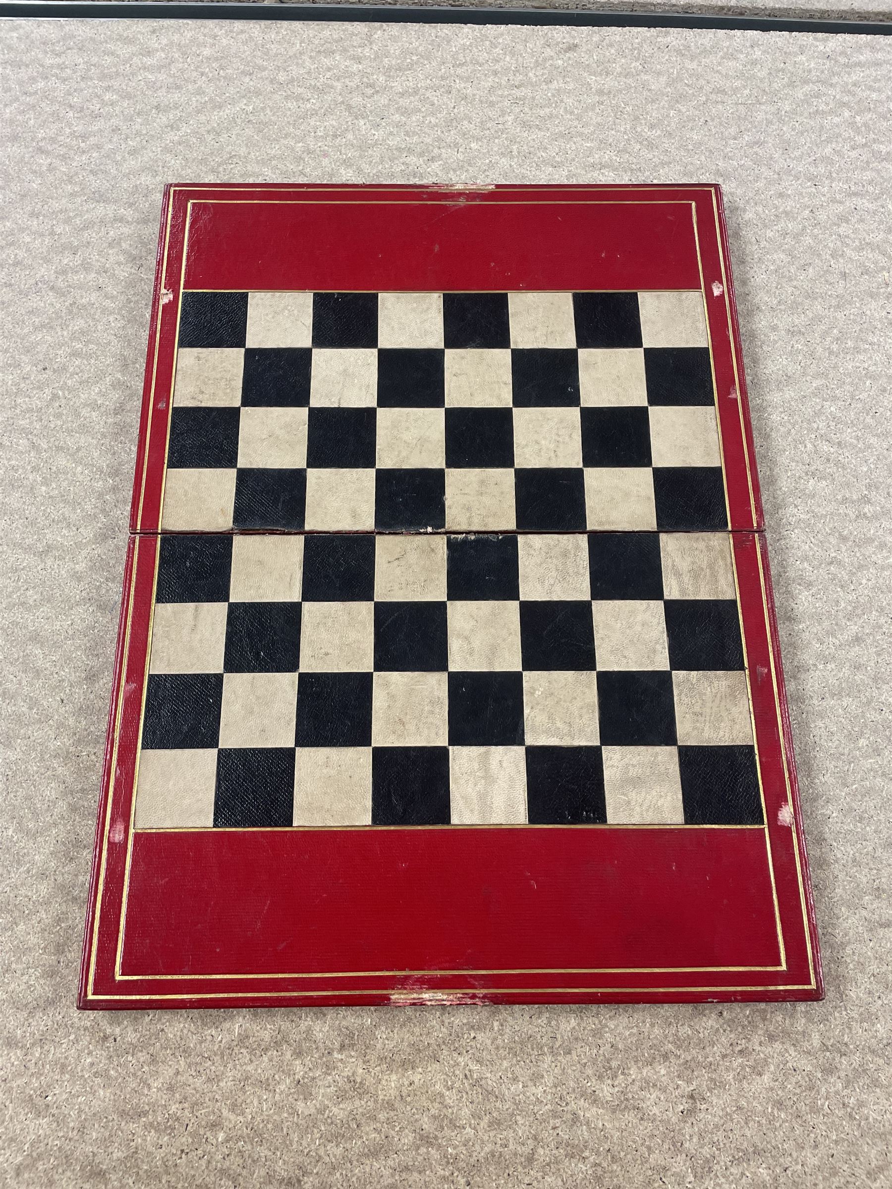 19th century walnut and brass bound games compendium box, painted to enhance the grain, of rectangular form, the hinged opening cover with rounded sides, central brass cartouche with engraved lion crest, and brass riveted straps, opening to reveal a red leather and blue silk lined compartmented interior, with fold-down games board, and lift-out tray containing playing cards, ebony turned dice towers, white and red stained bone draughts, and chess pieces, ivory dice, and ivory and ebony whist markers, and brass bezique board, cribbage board and markers, H15cm W32cm D24cm
This lot has been registered for sale under Section 10 of the APHA Ivory Act