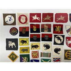 Approximately one-hundred printed and embroidered cloth badges including I, II, VIII, XI, XII and XXX Corps, Eastern Command, various Armoured Divisions, Midland, Wessex, Home Counties and 12th Infantry Brigades, Salisbury Plain, Northumberland, Hampshire, North Midland, West Riding, Essex and Suffolk Districts, Berlin & Rhine Army Troops etc