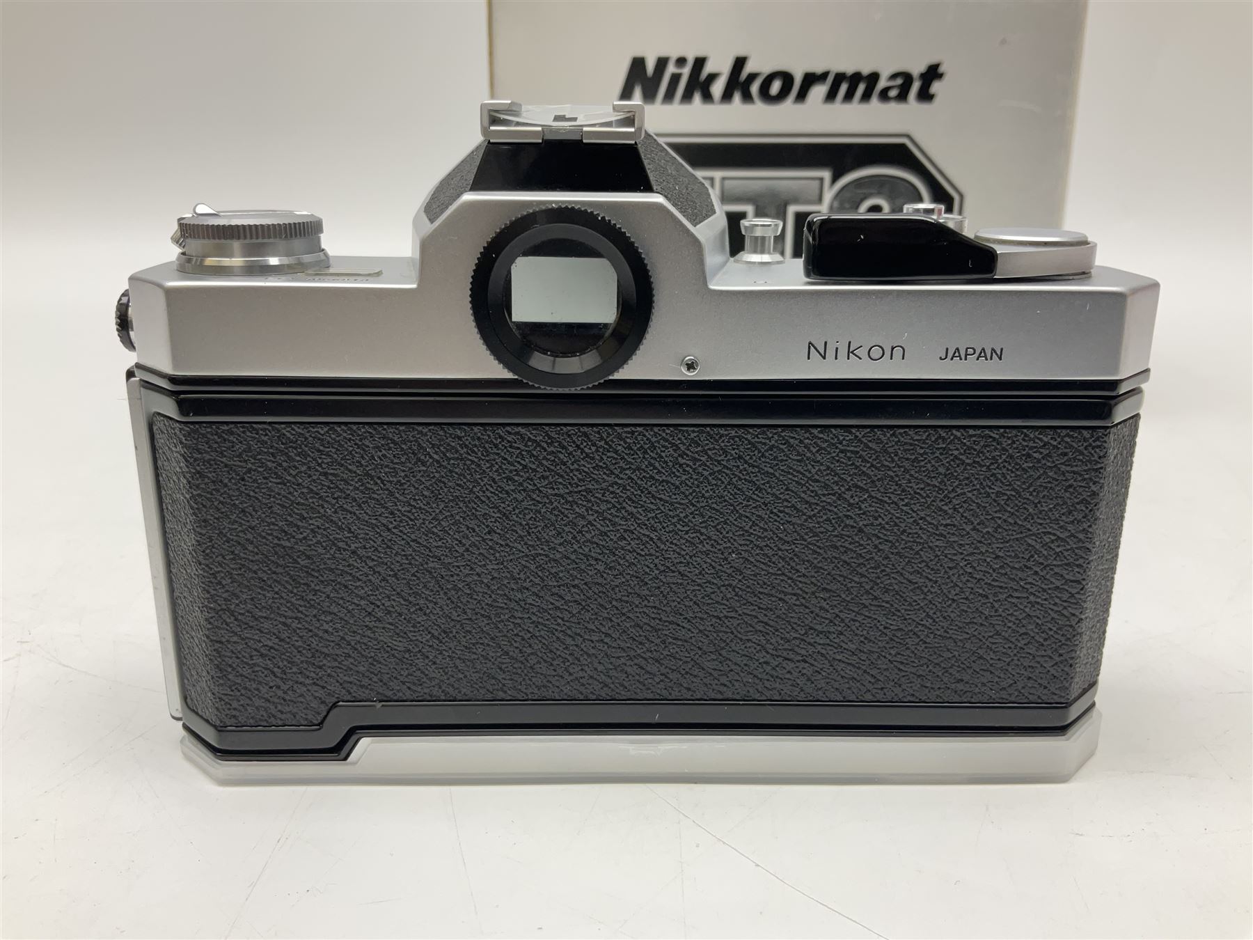 Nikkormat FT2 camera body, serial no. 5066813, in original packaging, together with Nikkormat EL camera body, serial no. 5577358, with Nikon Nikkor 50mm 1:1.8' lens no. 2143575, Nikkormat FT, serial no. 3968385, and Nikomat FT camera body, serial no. 4015491