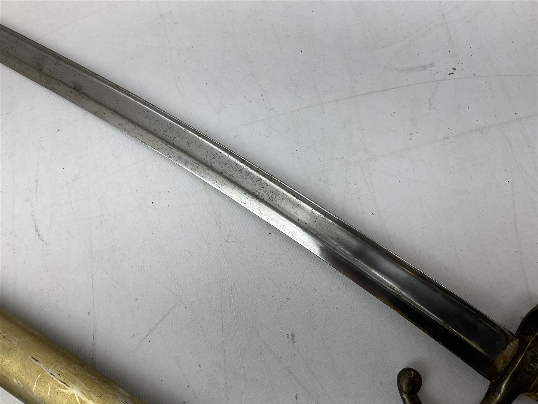 French Model 1866 sabre bayonet with 57cm fullered steel curving blade; in steel scabbard L71cm overall; another Model 1866 sabre bayonet lacking scabbard; and British Pattern 1856 sword bayonet (no scabbard) (3)