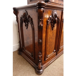  Singer treadle sewing machine with gilt transfer detail, in late 19th century walnut two tier cabinet with folding top above two burr panel doors, the maple interior with five drawers, W78cm, H98cm, D55cm   