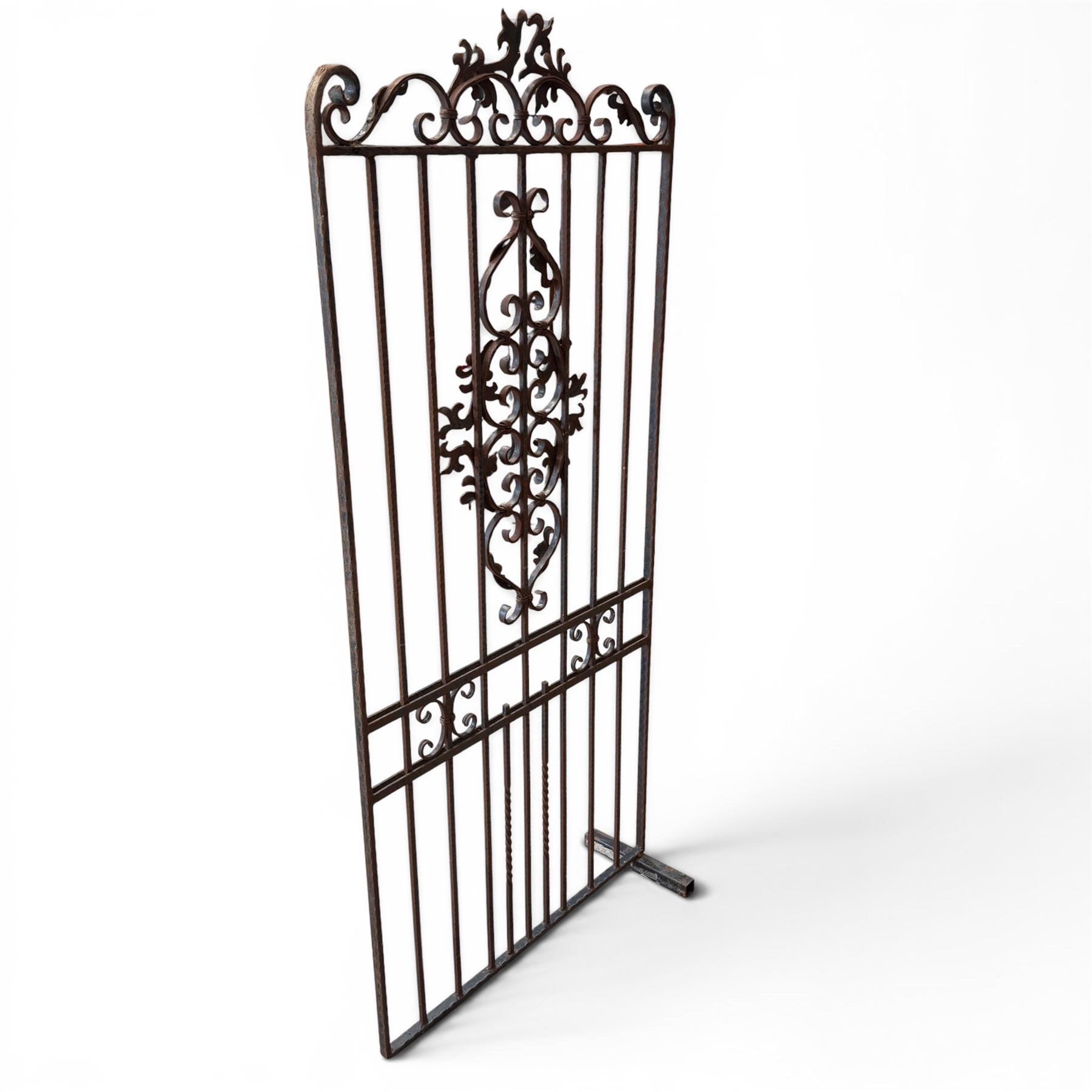 Victorian wrought iron vineyard gate, with ornate scrollwork and foliate acanthus leaf decoration, shaped cresting and central decorative panel, finished in rustic black painted finish