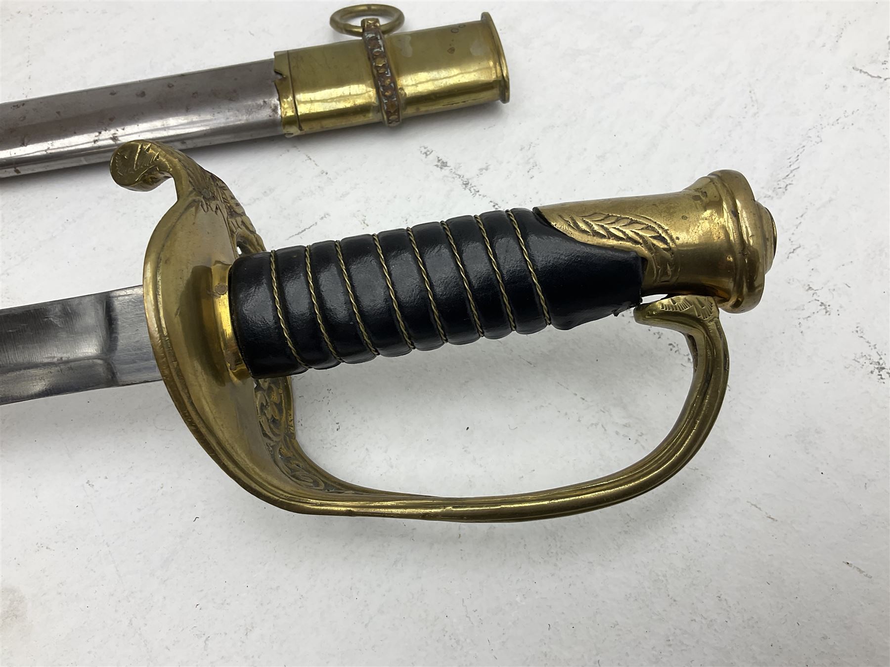 Reproduction American Civil War Cavalry trooper's sword, the 88cm slightly curving fullered steel blade marked to the ricasso 'Ames & Co Chicopee Mass.' and 'US ADK 1862'; brass hilt and leather covered grip; in steel scabbard L110cm overall;  and another reproduction sword (2)
