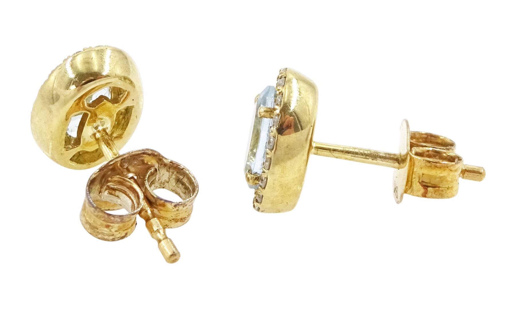 Pair of 9ct gold aquamarine and diamond earrings, each stud set with an oval cut aquamarine, with round brilliant cut diamond surround, stamped, total aquamarine weight approx 0.75 carat, total diamond weight approx 0.15 carat