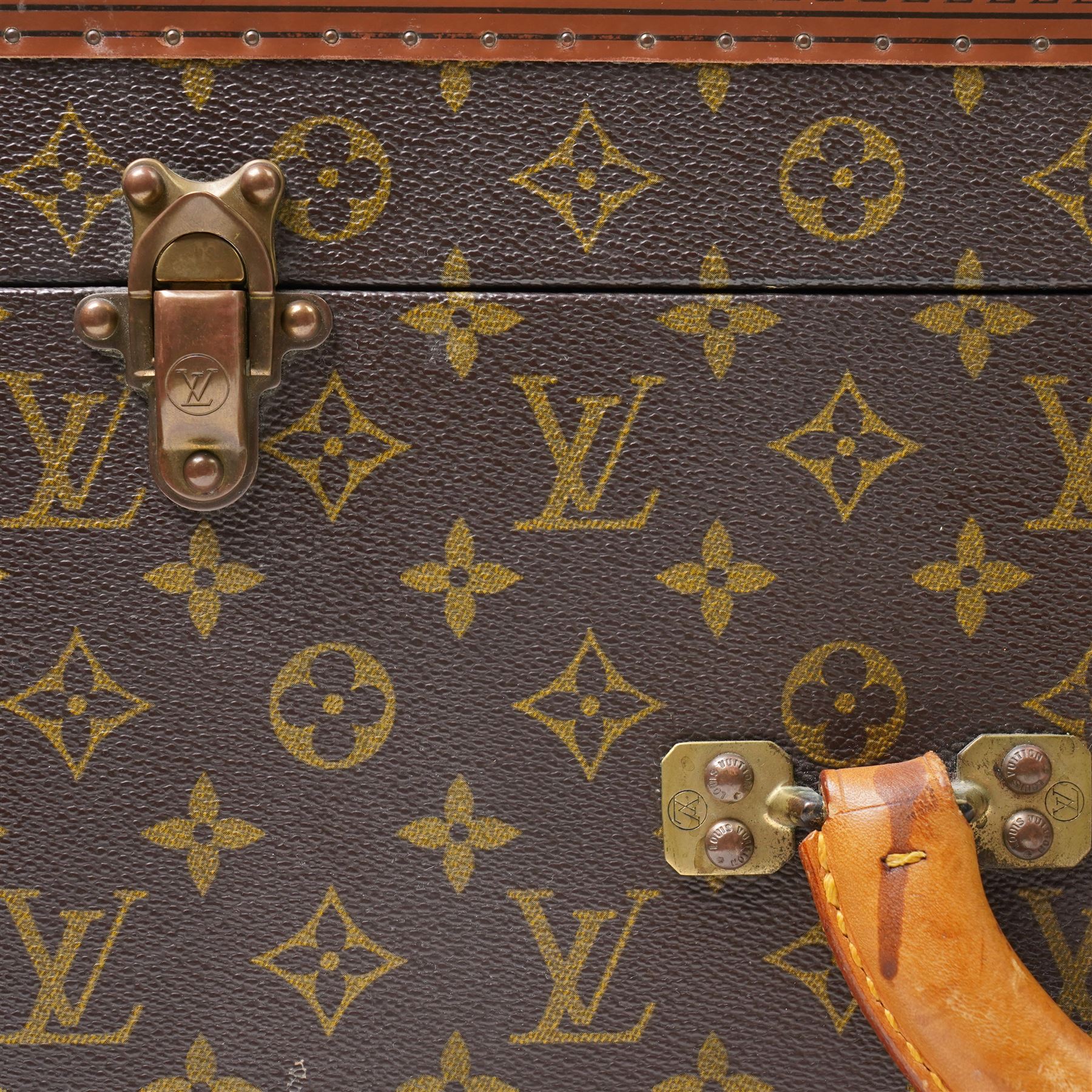 Mid-20th century Louis Vuitton monogram cabin trunk,  monogram canvas with lozine trim and brass mounts, single front leather handle with lock stamped Louis Vuitton with key code 1080701, the interior fitted with original webbing straps and lift-out tray, label to lid printed 'Avenue Marceau 78bis - Paris Nice - 2 Avenue de Suède' serial number 953998, circa1960s, with original key present
