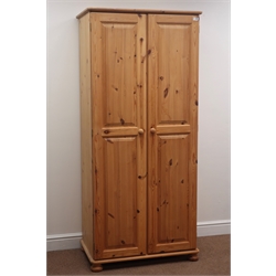  Solid pine double wardrobe, two doors enclosing fitted interior, bun feet, W82cm, H180cm, D51cm  
