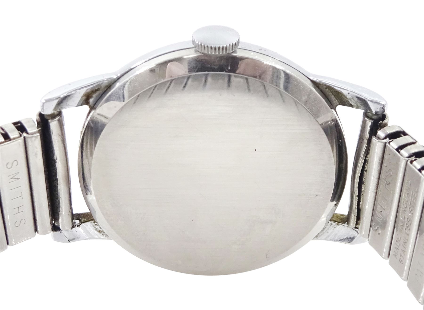 Tudor gentleman's stainless steel manual wind wristwatch, circa 1950's, Ref. 12856, silvered textured dial with Arabic hour markers and subsidiary seconds hands, back case signed Dennison for Rolex and numbered 12856 6545, on expanding stainless steel strap