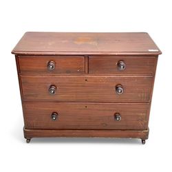Victorian 19th century stained pine chest of drawers, rectangular top above two short and three long drawers with turned wooden handles, raised on bun feet with castors.