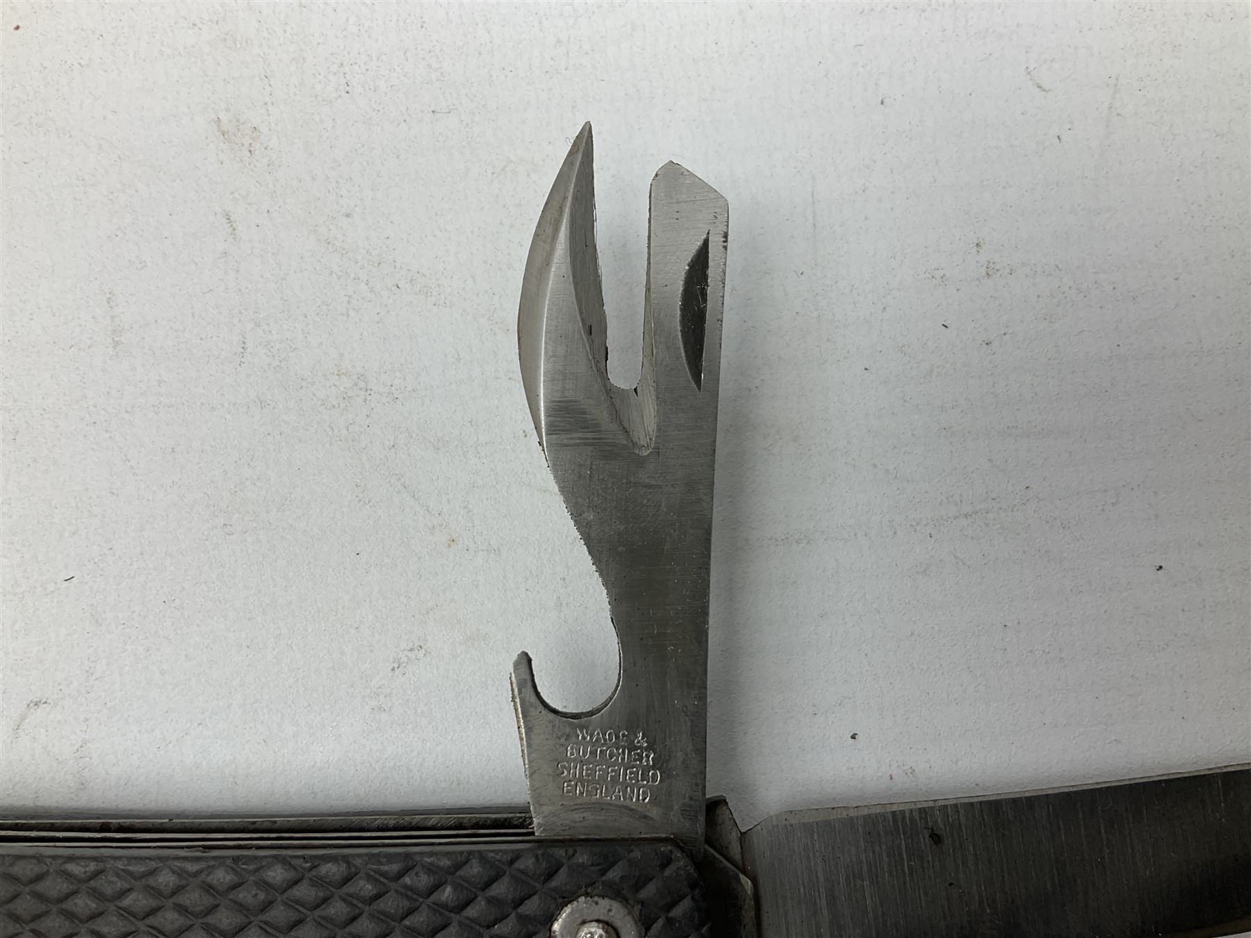 WW2 British army folding jack/clasp knife with blade and can opener marked with broad arrow and date 1944; a similar unmarked British army folding three-blade knife; and another later similar British Army knife marked Wade & Butcher Sheffield England (3)