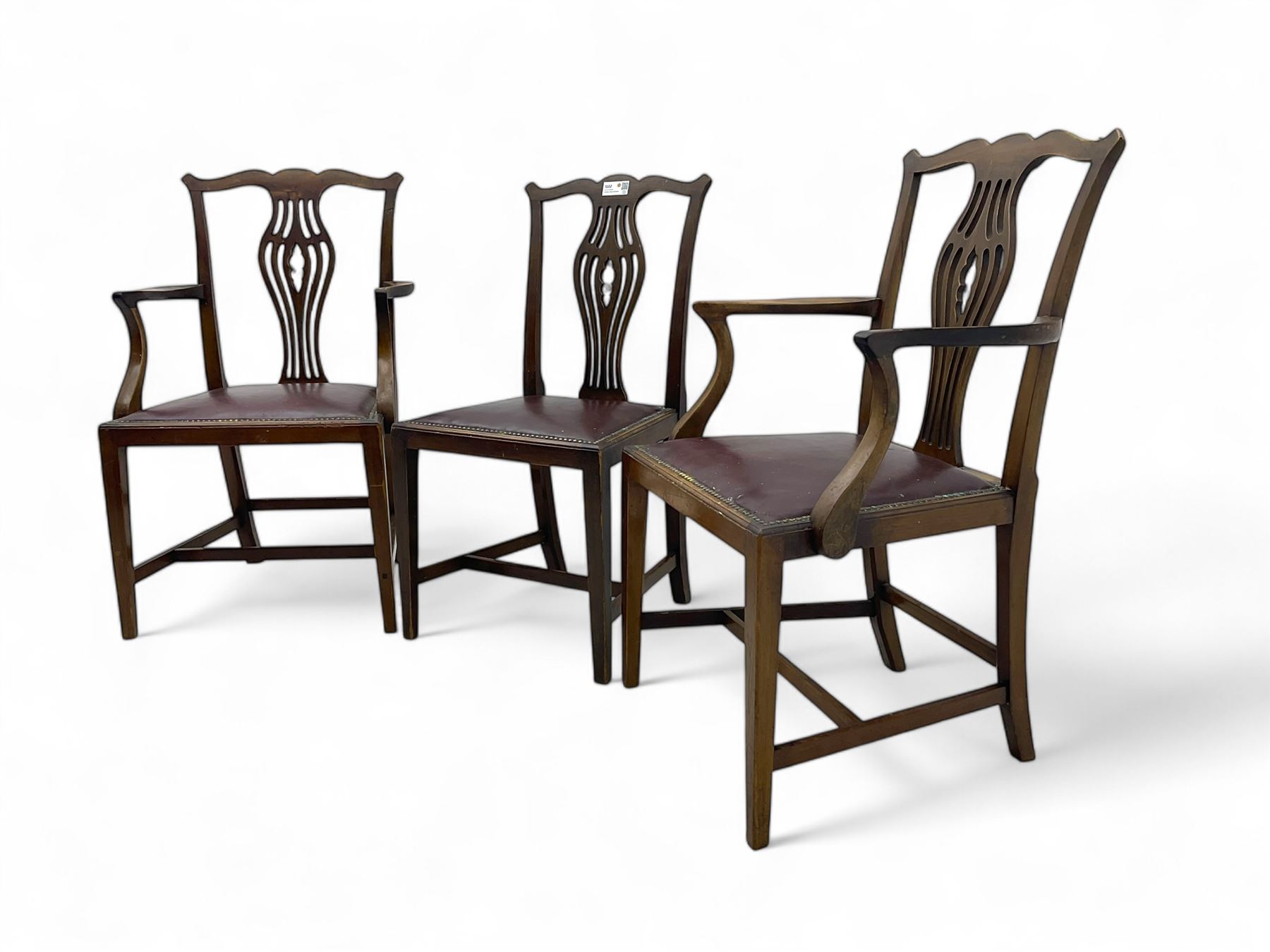 Set of six (4+2) 19th century Chippendale-design mahogany dining chairs, shaped cresting rail over pierced bulbous vase-shaped splat, burgundy leather upholstered seats with brass stud trim, on square tapering supports united by H-stretchers