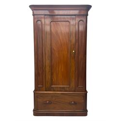 Large Victorian mahogany wardrobe, projecting moulded cornice over single panelled door enclosing hanging hooks and sliding rail, the base fitted with full width drawer, on plinth base

