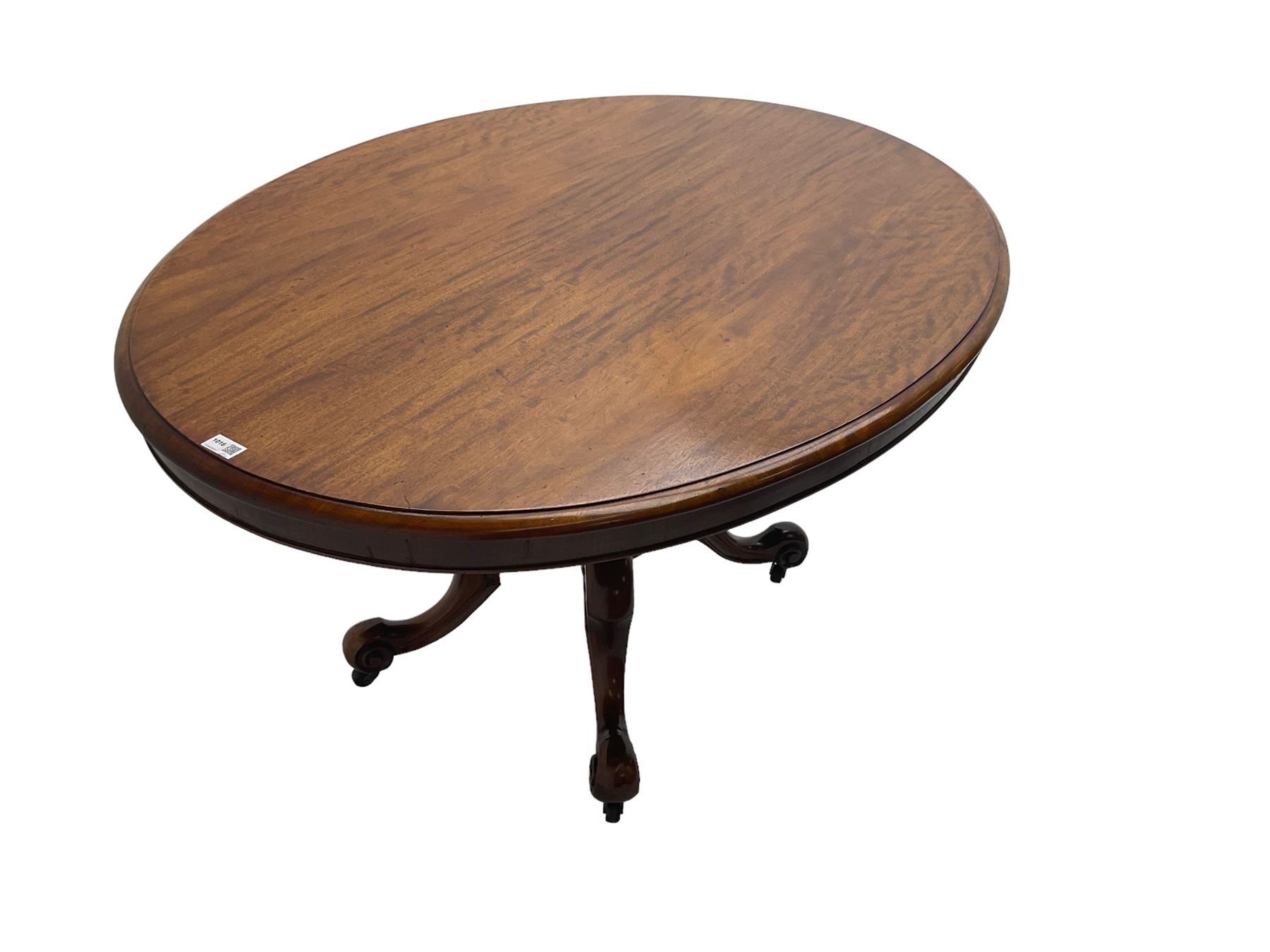 Victorian mahogany oval loo table, moulded edge with banded frieze, raised on baluster turned pedestal with quadrupod base, cabriole supports with scroll feet and castors
