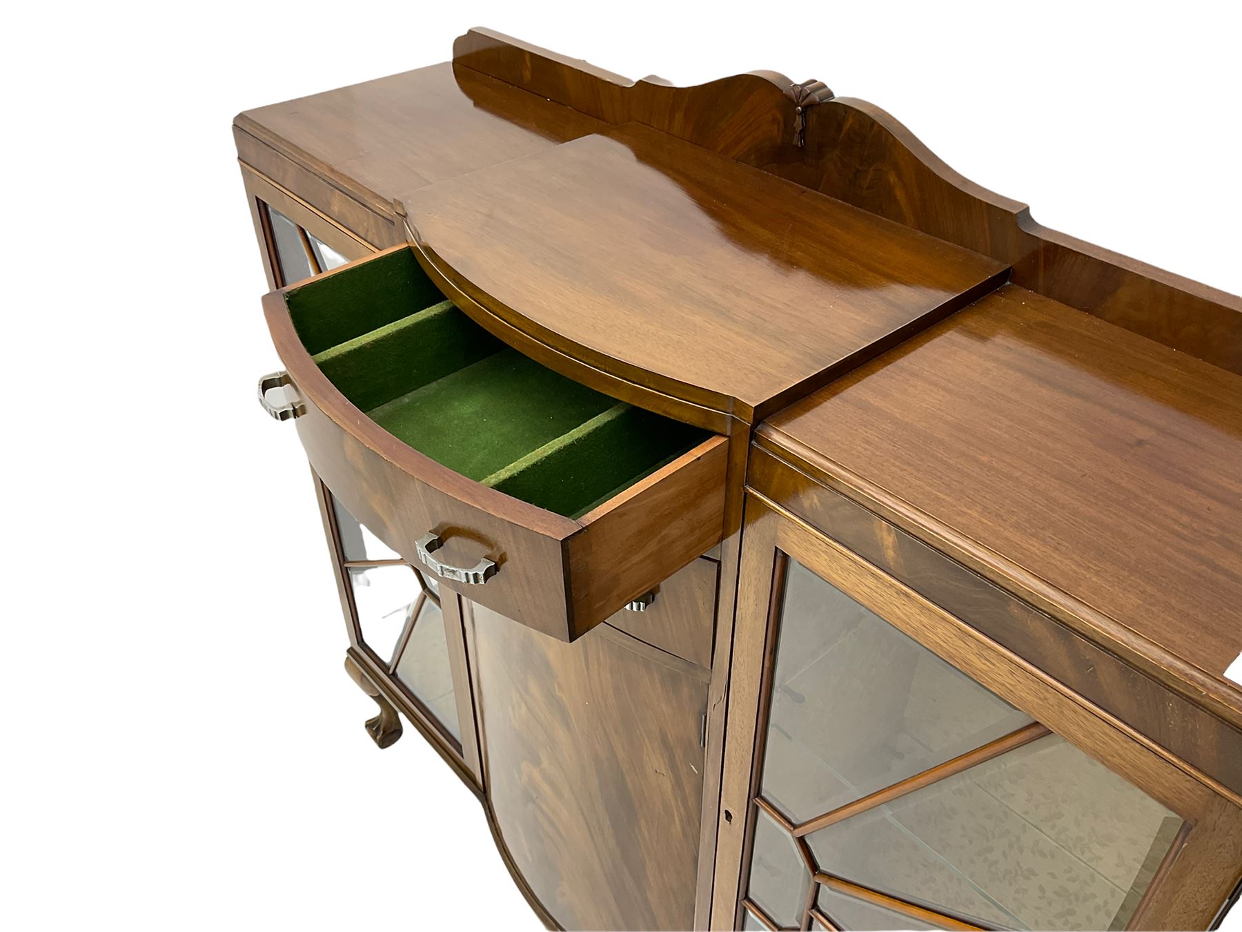 Mid-20th century Art Deco style walnut display cabinet, two central drawers over cupboard flanked by two bevel glazed display cabinets with sunburst astragal glazing, on ball and claw cabriole feet