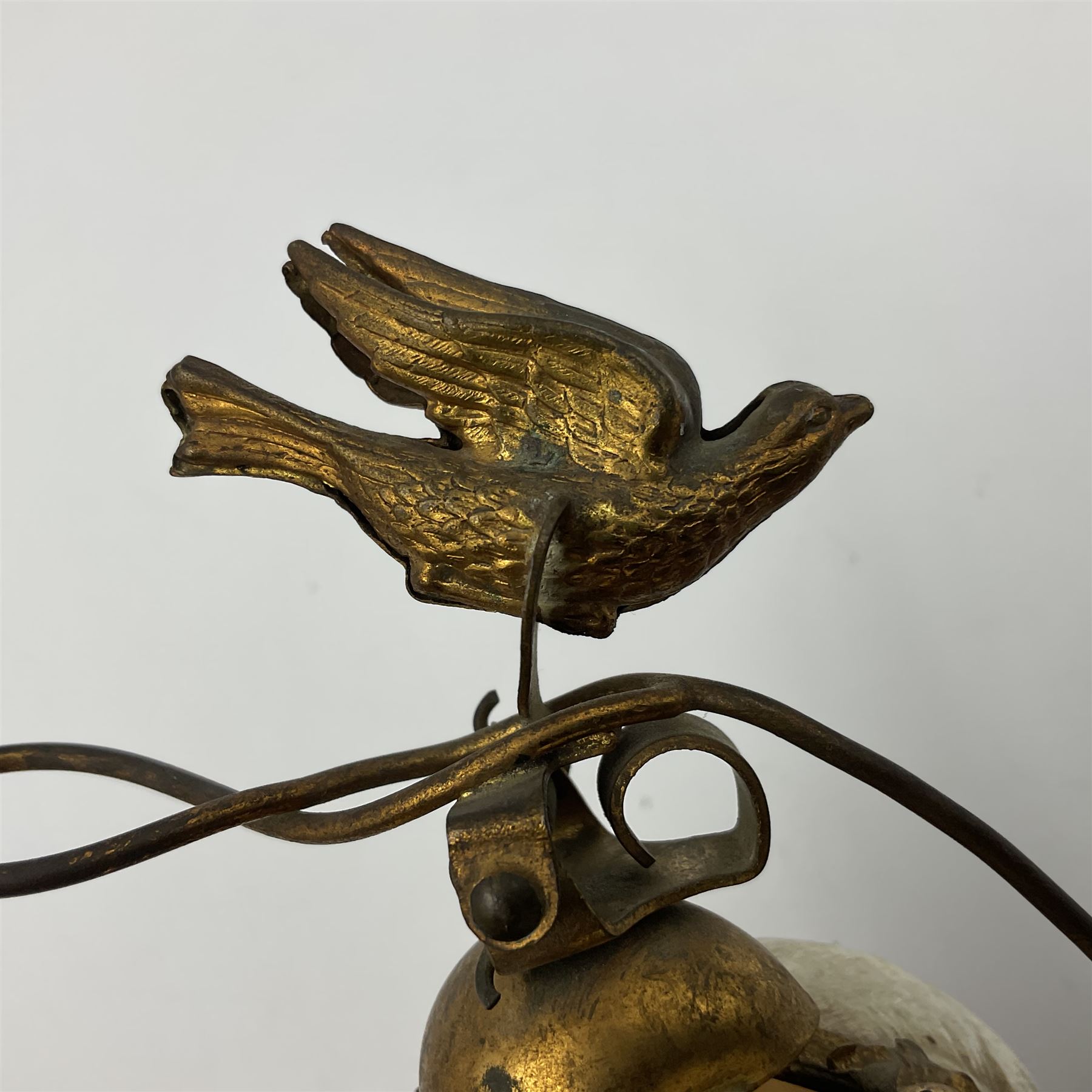 Victorian evening dinner bell, with three mother of pearl shells, floral and grape gilt decoration, and bird finial, raised upon a circular soapstone base with gilt pierced gallery, H14cm