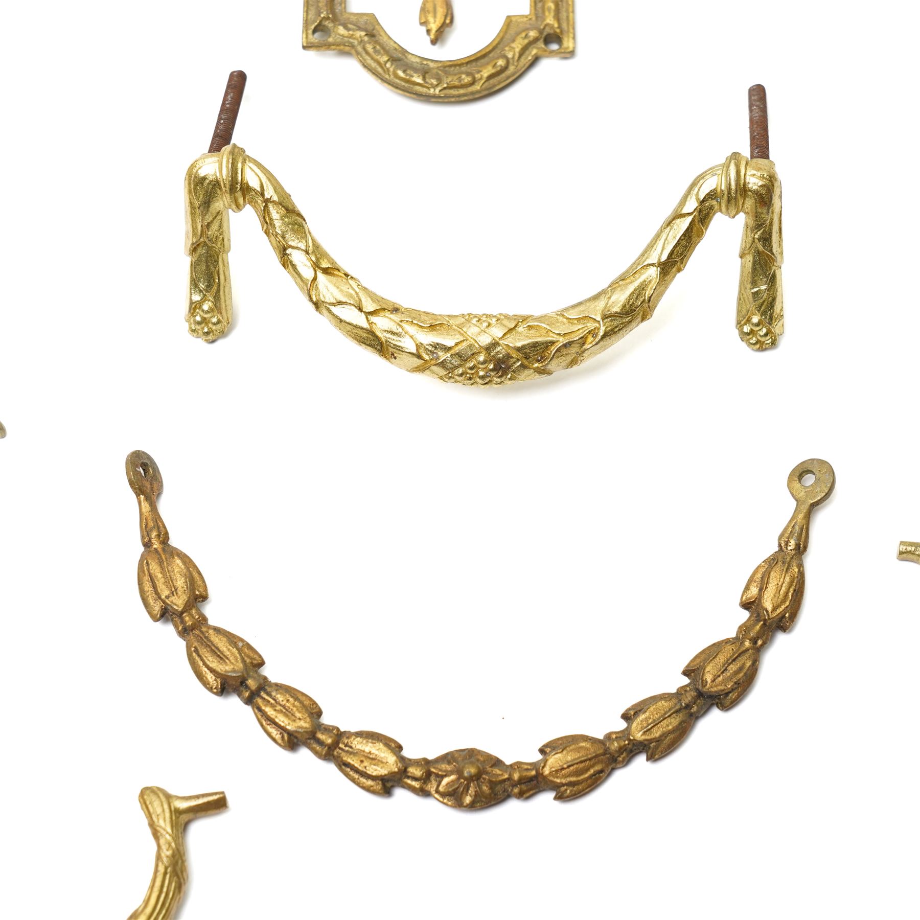 Set of eight brass cabinet door plates formed as lyres marked 'H.V' 9.5cm x 12cm, seven brass cabinet door handles of leaf design, various other handles, boss and a two branch wall light 
Provenance: property of a Nobleman