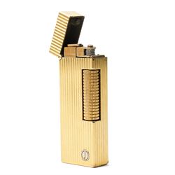 Dunhill - Rollagas lighter, gilt metal with vertical reeded decoration and ribbed thumbpiece, H6.5cm 