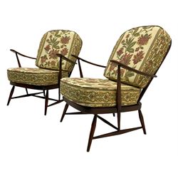 Ercol - Pair of mid-20th centur medium elm framed easy chairs, with loose patterned covers with folate design